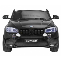 BMW X6M XXL pre 2 deti Lak čierna + Diaľkové ovládanie + Eko koža + Bezpečnostné pásy + Pomalý štart + MP3 + LED